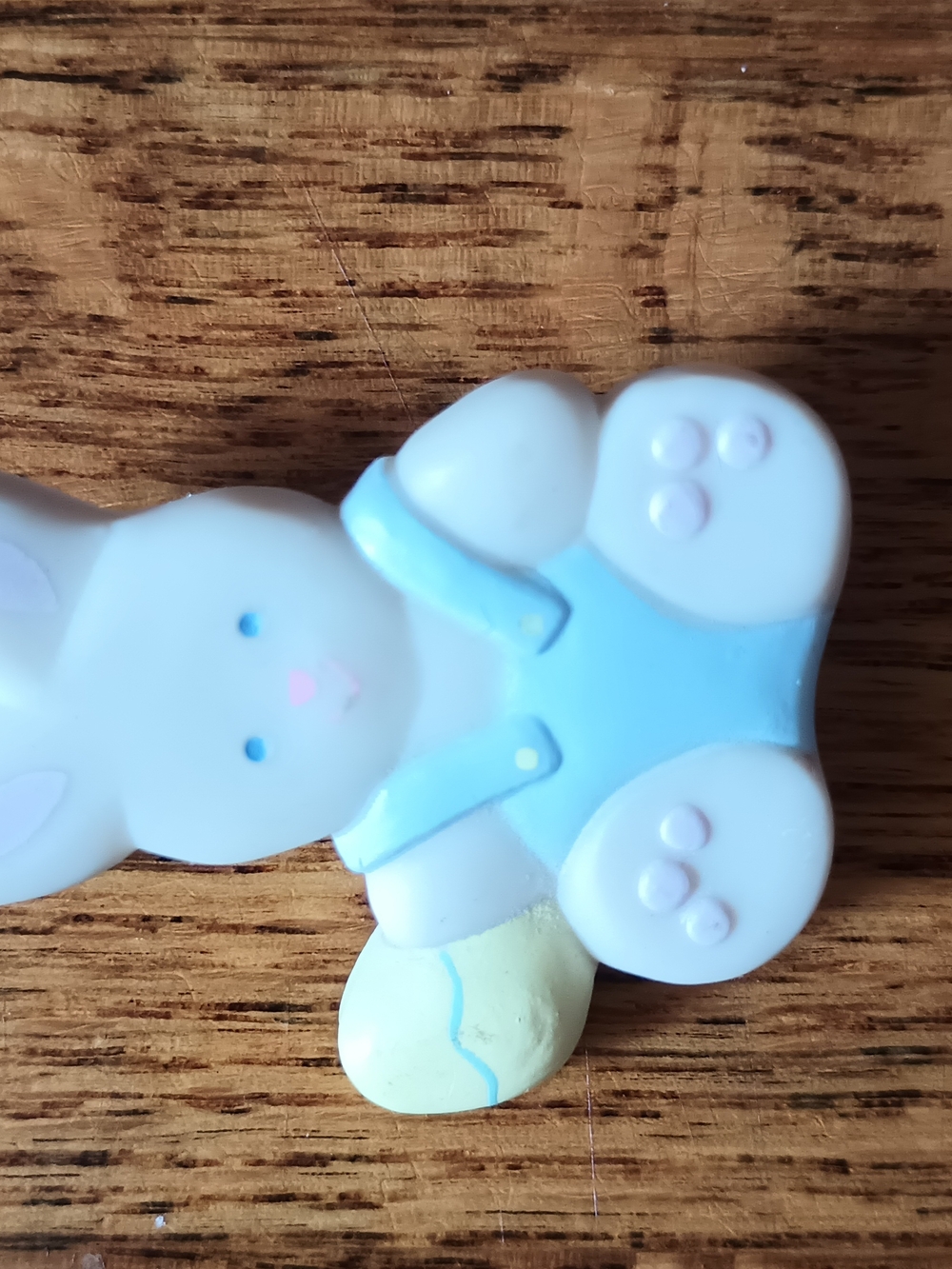 Vintage 1990 Hallmark Easter Rabbit Lapel Pin in blue bibs with yellow egg